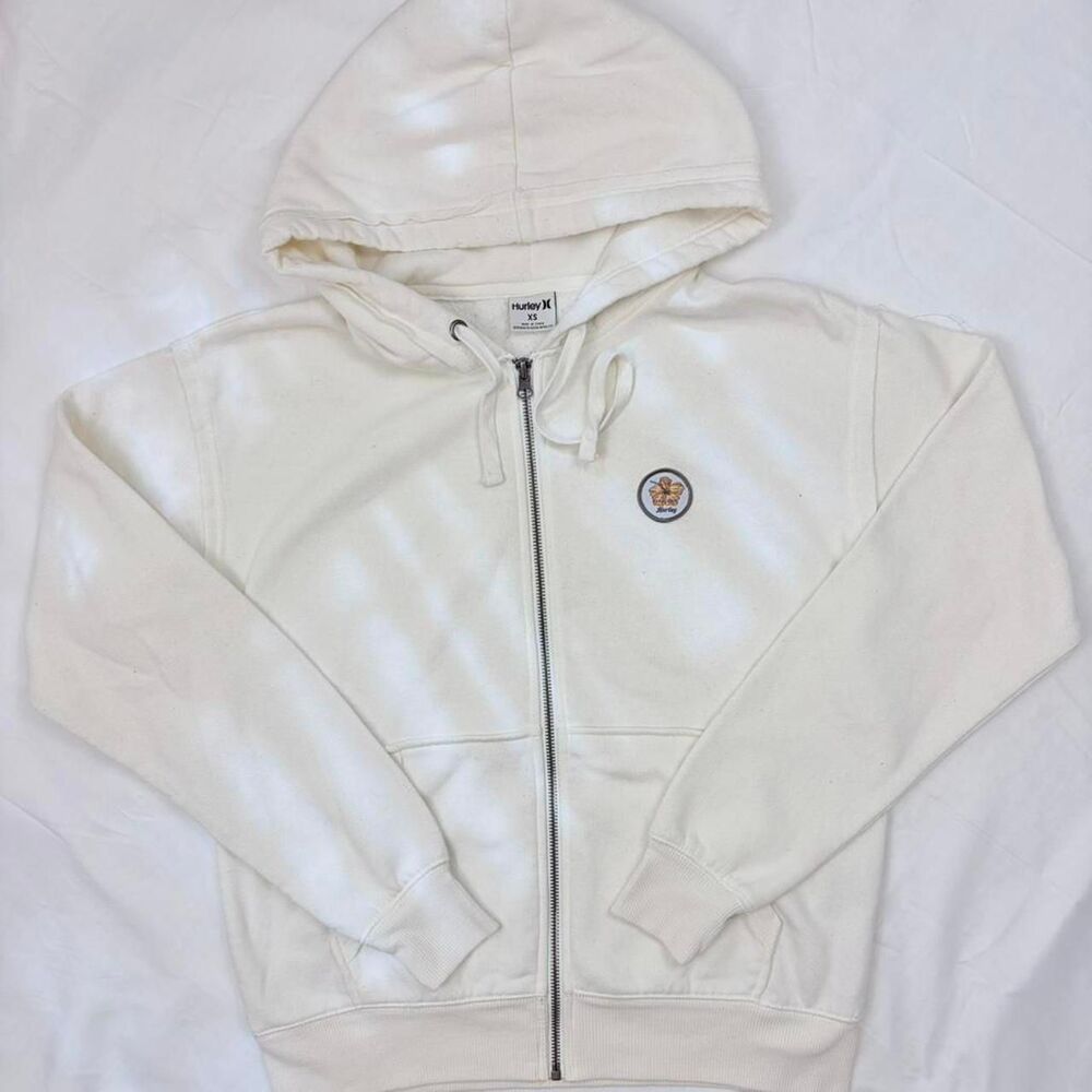 hurley | size xs | cream zip up hoodie w/ hibiscus logo patch